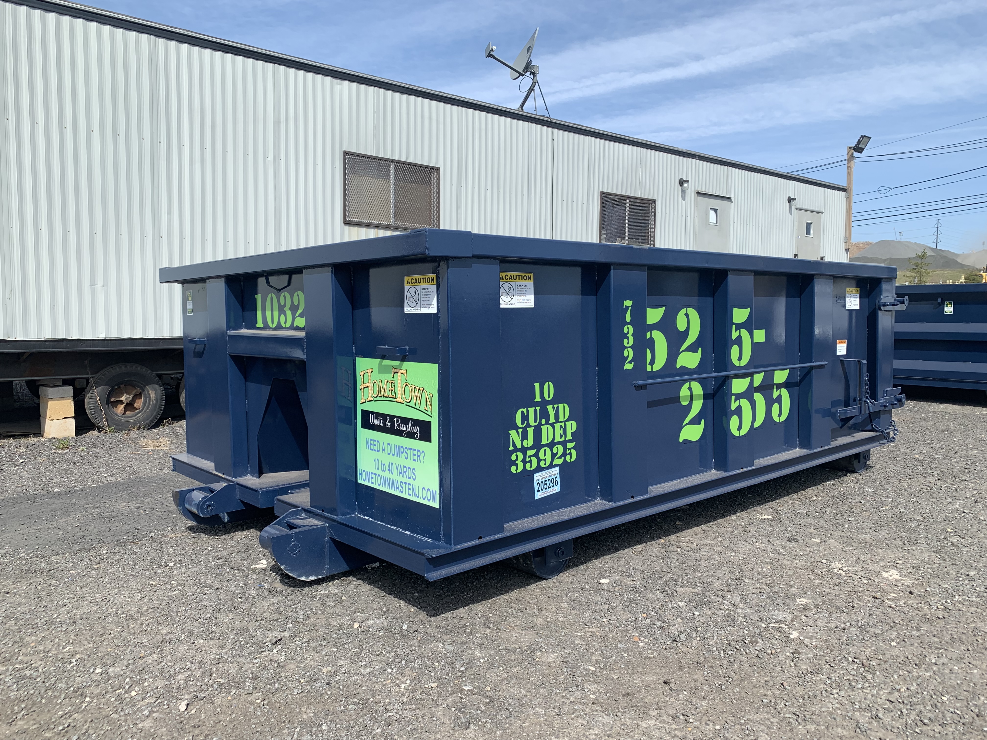 dumpster in front of trailer
